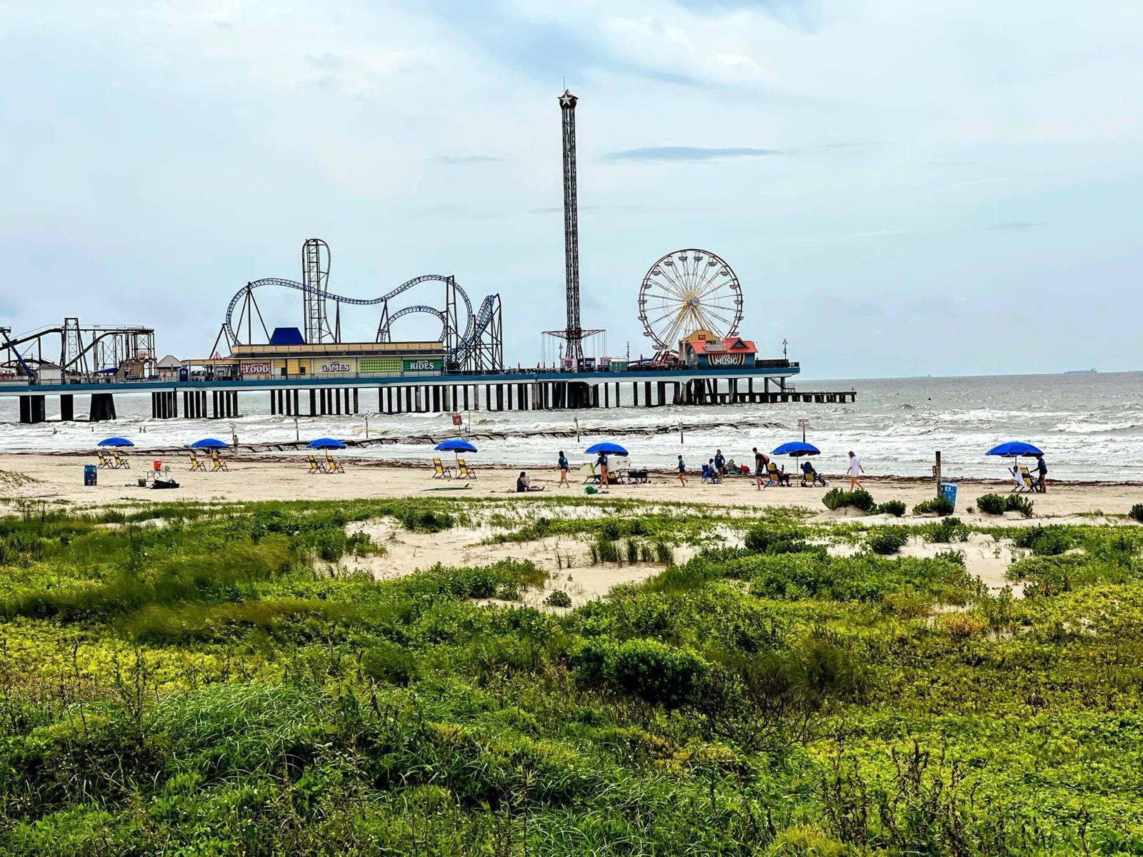 Pleasure Pier's rides over the Gulf, seen from the dunes