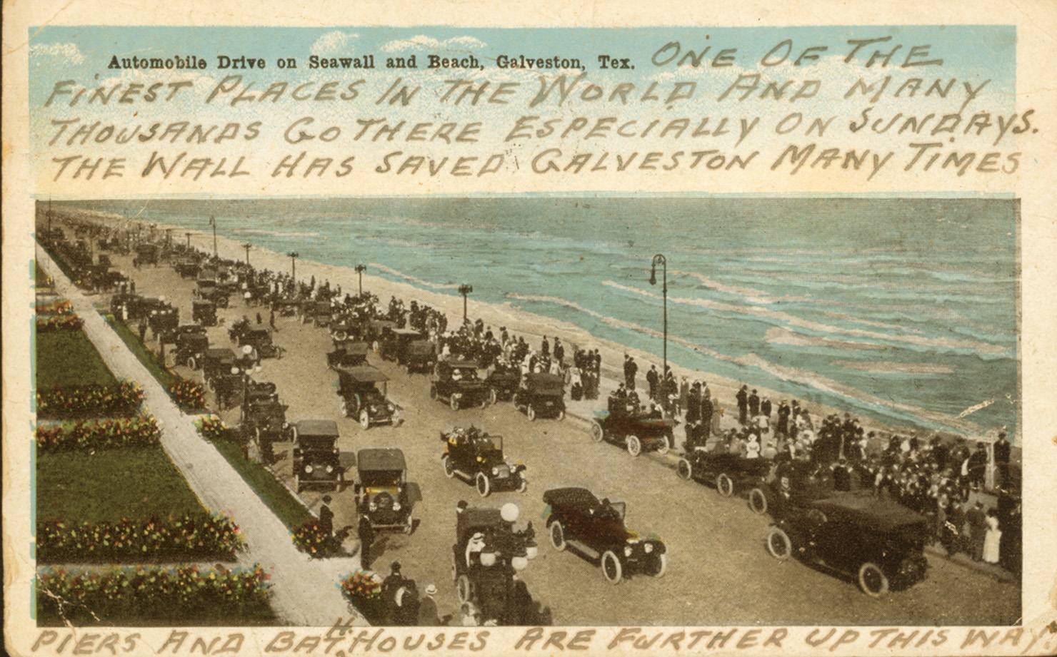 Postcard mailed in 1918: cars on the drive along the Seawall above a crowded beach